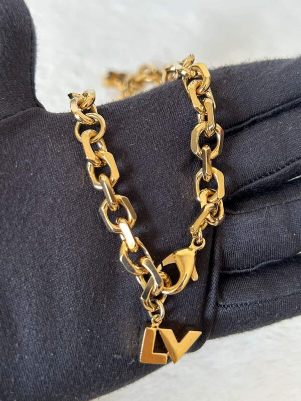 Louis Vuitton Vintage Hide And Seek Necklace in Metallic